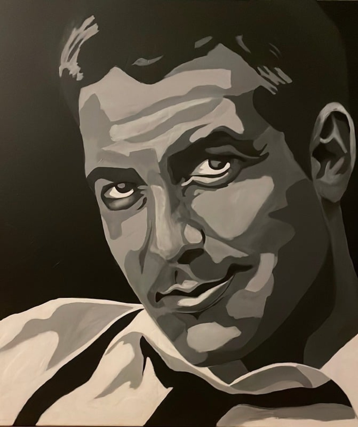 Greyscale pop-art portrait of a man glancing over his shoulder.